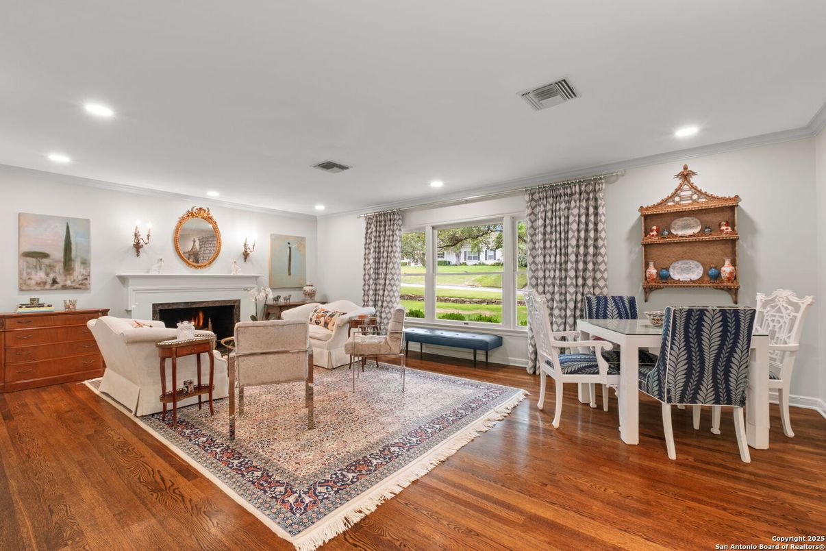 Dining room, Fireplace, Interior, Living room, Recessed Lighting, Wood Texture Flooring
