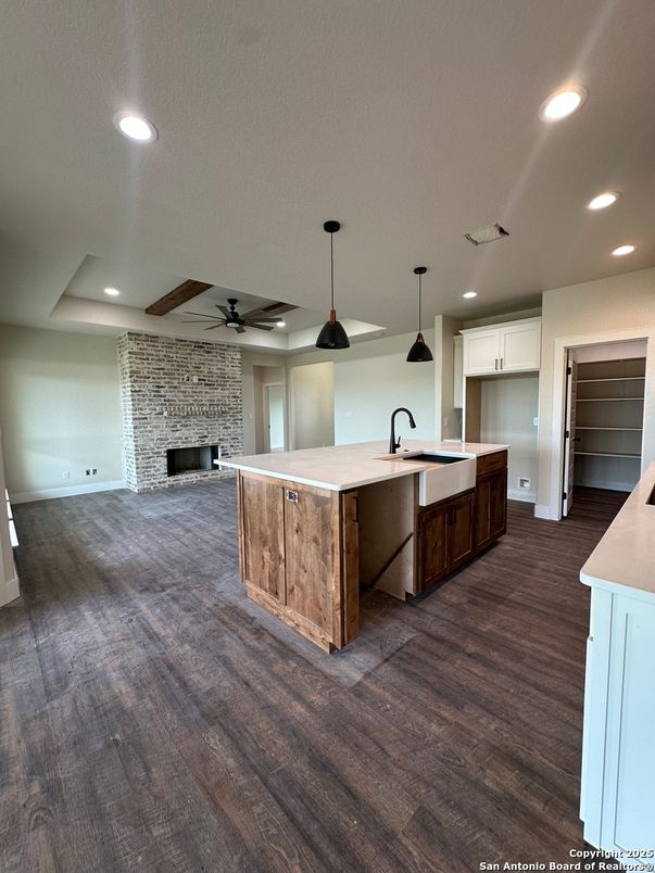Fireplace, Interior, Kitchen, Pendant Lights, Recessed Lighting, Stone Walls, Wood Texture Flooring