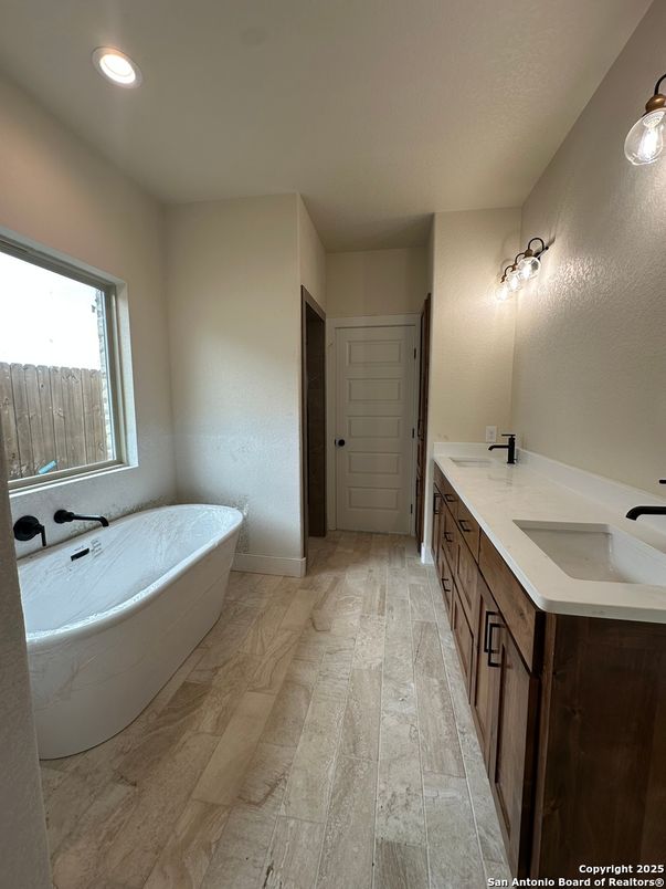 Bathroom, Dual Sink Vanities, Free Standing Baths, Interior, Recessed Lighting, Wood Texture Flooring