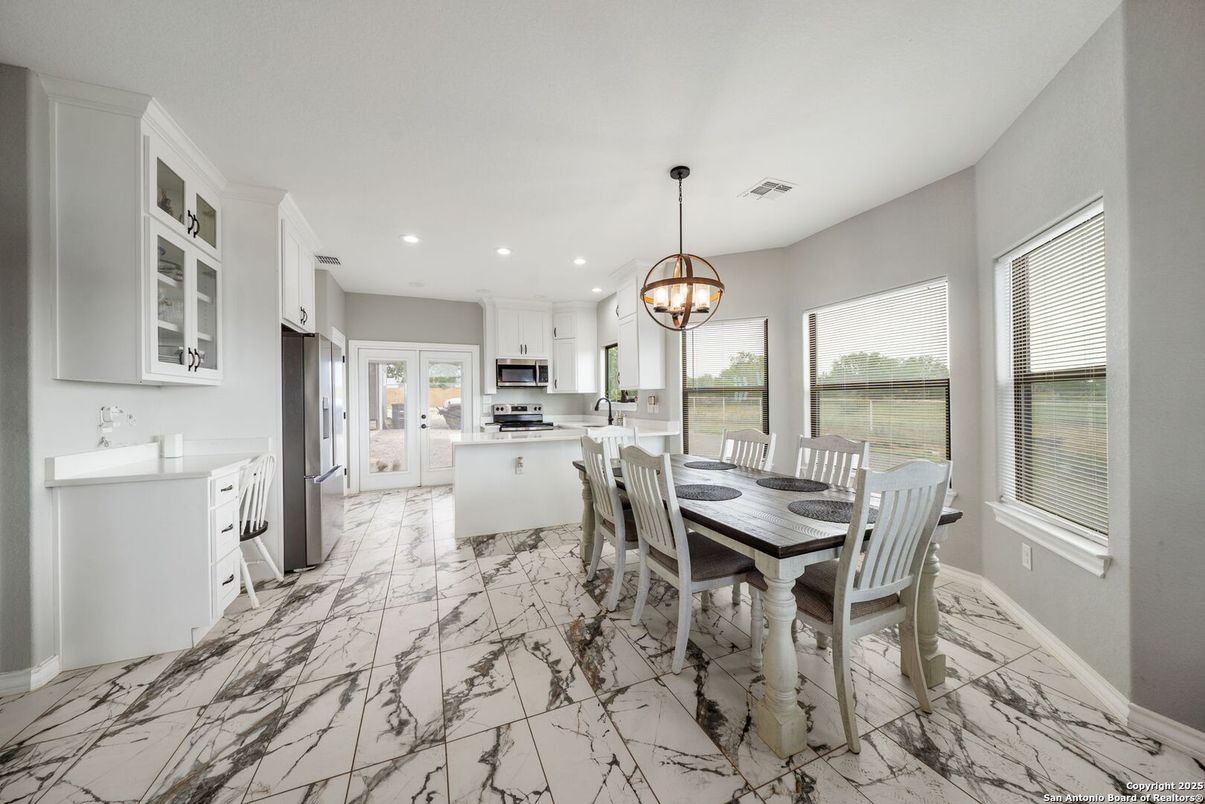 Chandelier, Dining room, Interior, Kitchen, Marble, Pendant Lights, Recessed Lighting, Stainless Steel Appliances