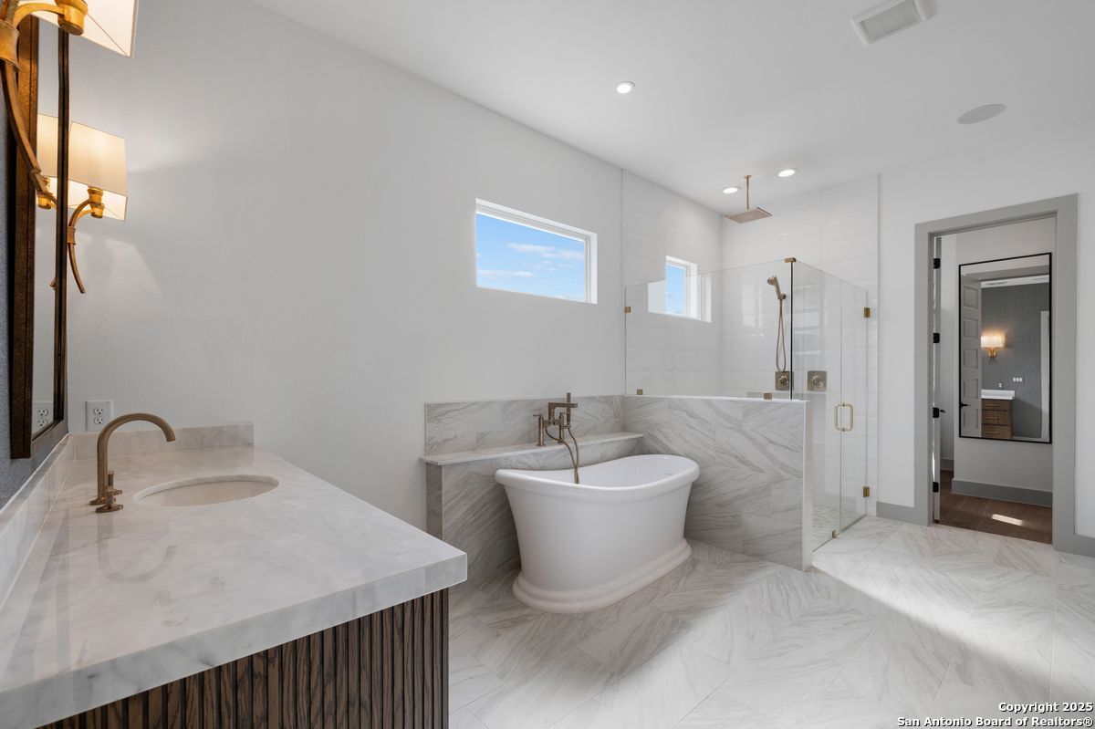 Bathroom, Dual Sink Vanities, Free Standing Baths, Glass Shower, Interior, Marble, Marble Walls, Recessed Lighting