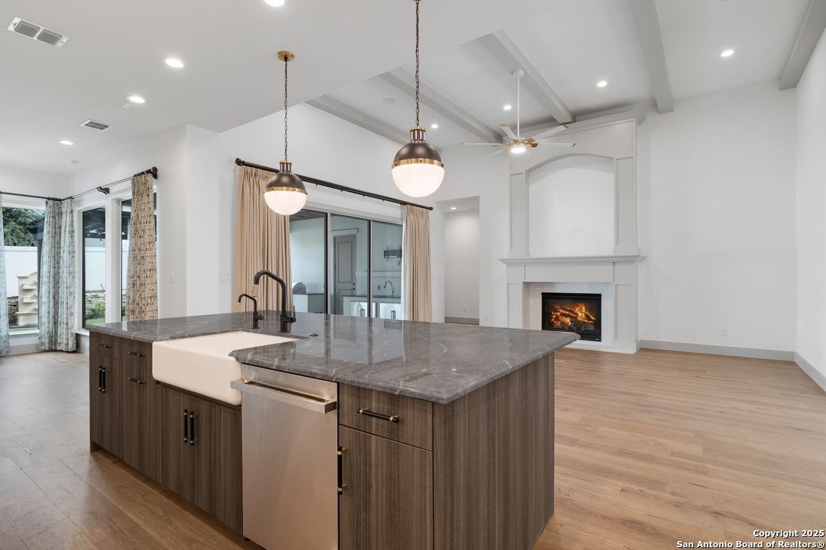 Fireplace, Interior, Kitchen, Pendant Lights, Recessed Lighting, Stainless Steel Appliances, Wood Texture Flooring