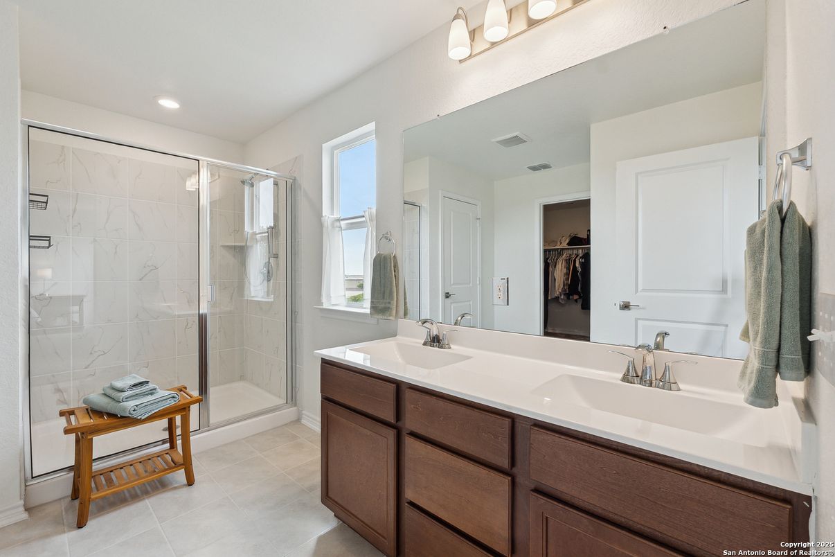 Bathroom, Dual Sink Vanities, Glass Shower, Interior, Marble Walls, Recessed Lighting