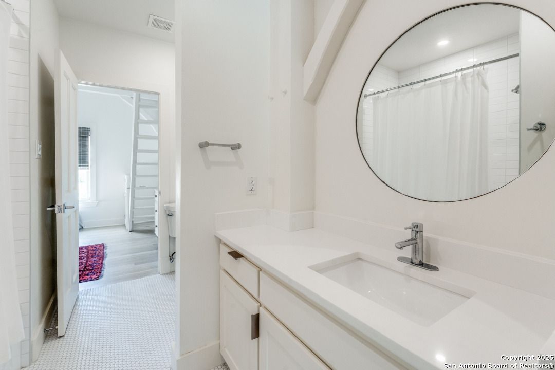 Bathroom, Dual Sink Vanities, Interior, Recessed Lighting, Wood Texture Flooring