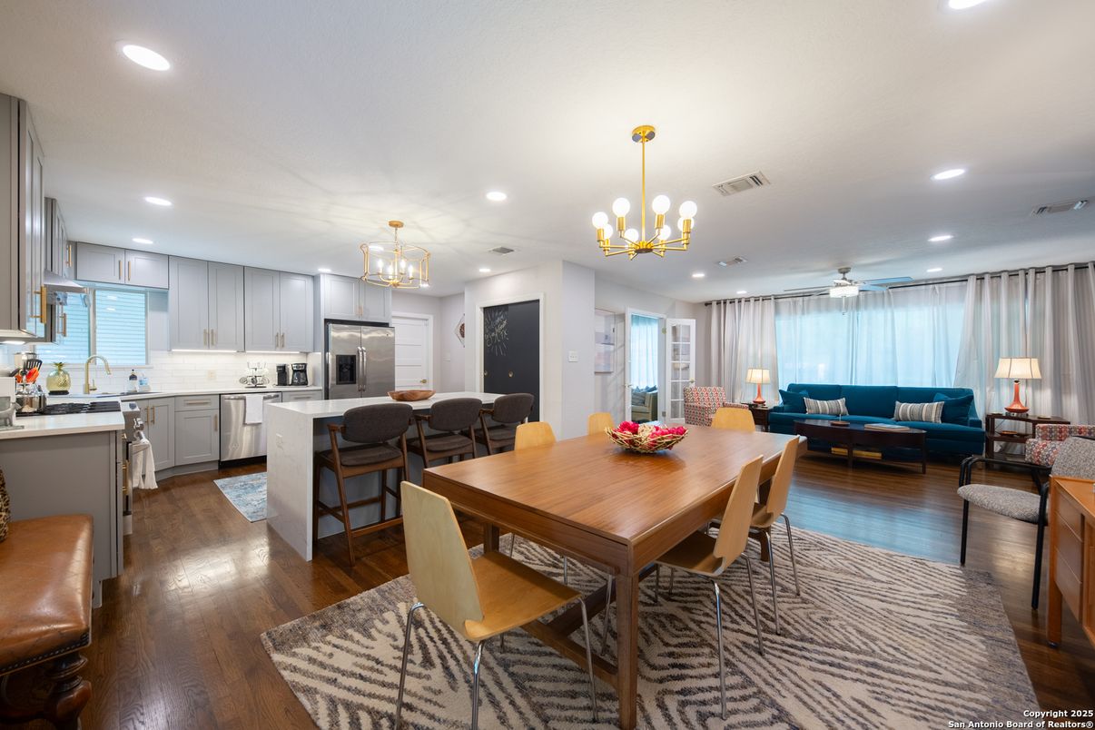 Chandelier, Dining room, Interior, Kitchen, Living room, Pendant Lights, Recessed Lighting, Stainless Steel Appliances, Wood Texture Flooring