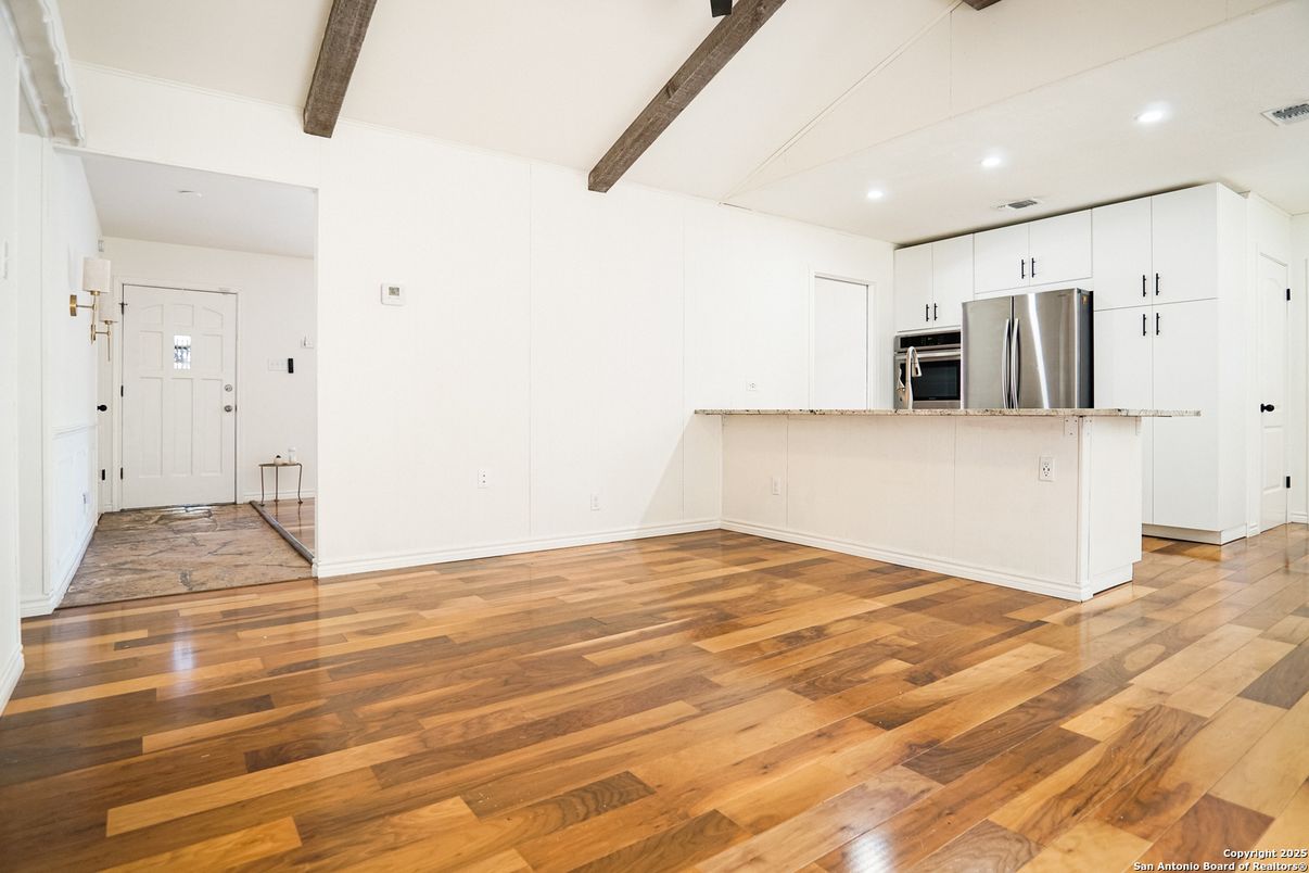 Empty room, Interior, Kitchen, Recessed Lighting, Stainless Steel Appliances, Wooden Beams, Wood Texture Flooring