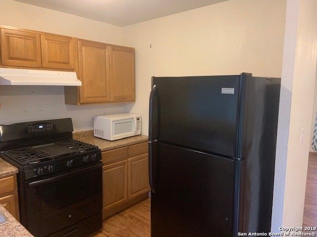 Interior, Kitchen, Tile Countertops, Wood Texture Flooring