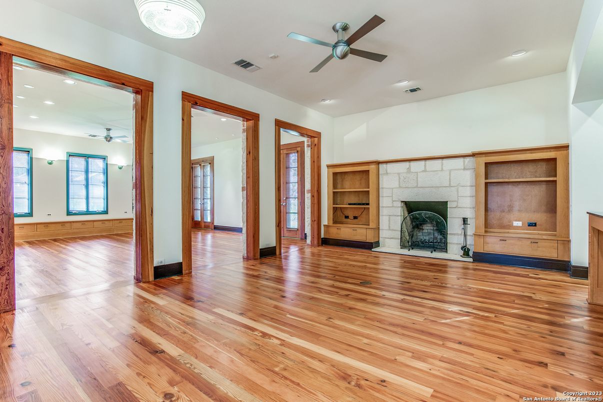 Empty room, Fireplace, Interior, Recessed Lighting, Stone Walls, Wood Texture Flooring