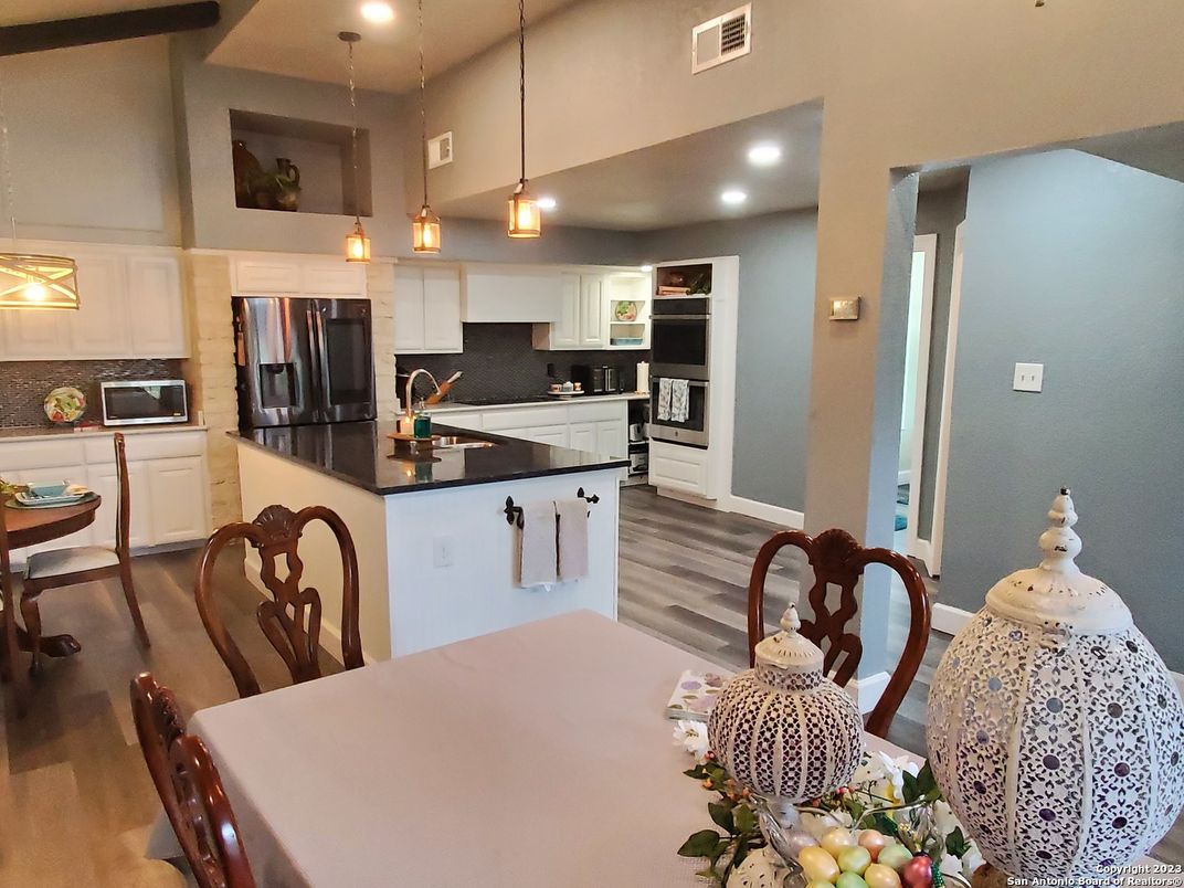 Dining room, Interior, Kitchen, Pendant Lights, Recessed Lighting, Stainless Steel Appliances, Wood Texture Flooring