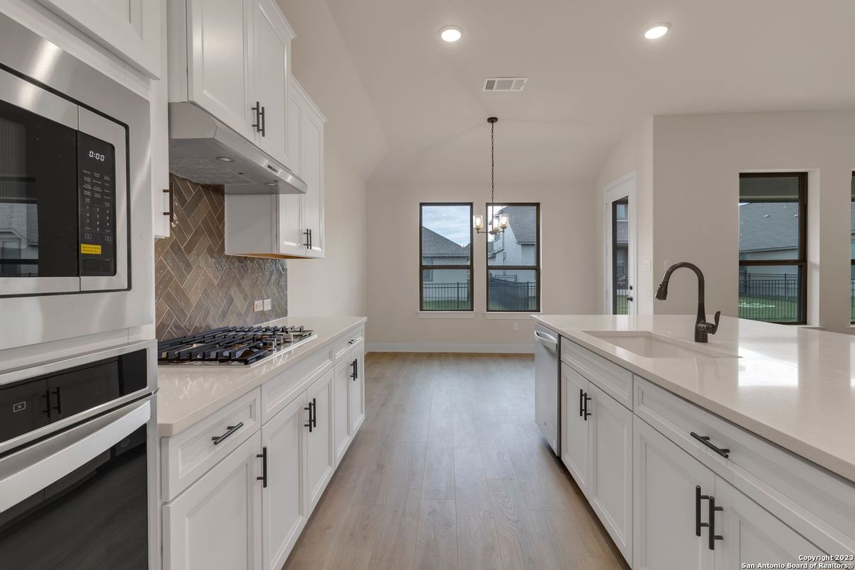 Interior, Kitchen, Pendant Lights, Recessed Lighting, Stainless Steel Appliances, Water, Wood Texture Flooring