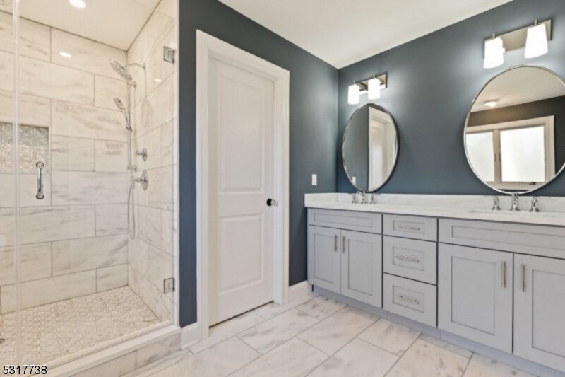 Bathroom, Dual Sink Vanities, Glass Shower, Interior, Marble Walls, Recessed Lighting