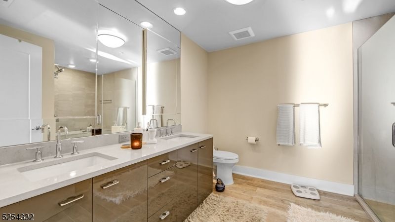 Bathroom, Dual Sink Vanities, Glass Shower, Interior, Recessed Lighting, Wood Texture Flooring