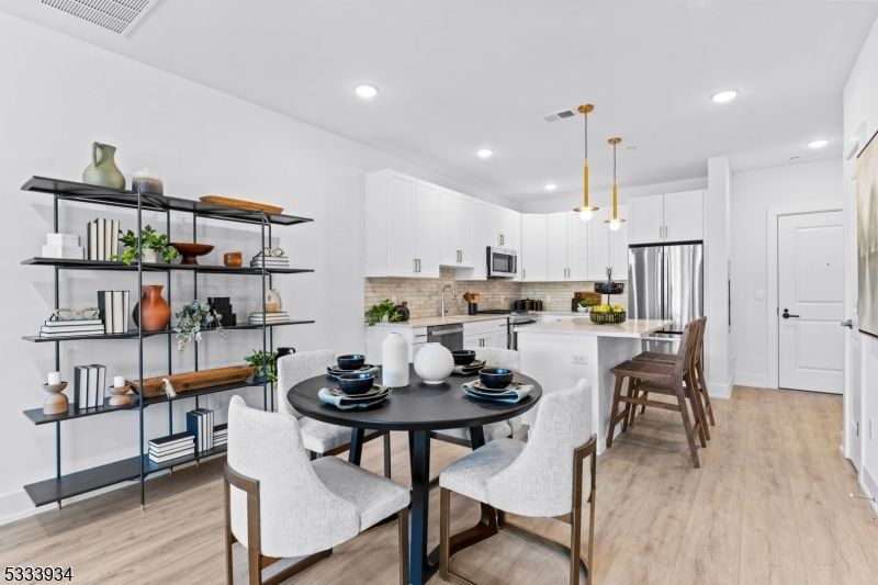 Dining room, Interior, Kitchen, Pendant Lights, Recessed Lighting, Stainless Steel Appliances, Wood Texture Flooring