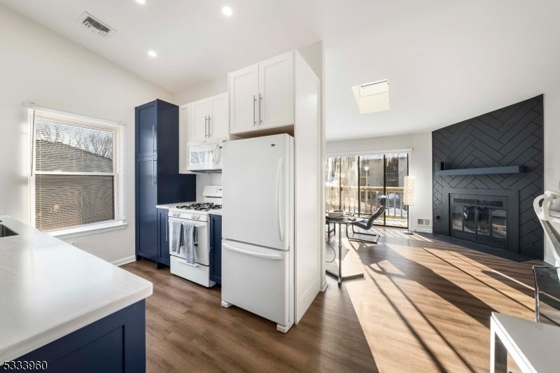 Fireplace, Interior, Kitchen, Recessed Lighting, Wood Texture Flooring
