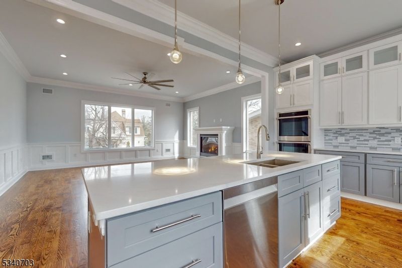 Fireplace, Interior, Kitchen, Pendant Lights, Recessed Lighting, Stainless Steel Appliances, Wood Texture Flooring