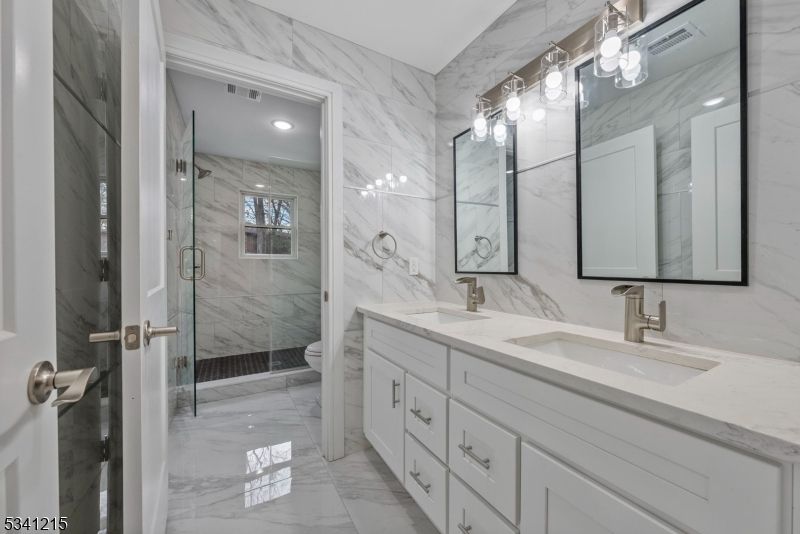 Bathroom, Dual Sink Vanities, Glass Shower, Interior, Marble, Marble Walls, Recessed Lighting