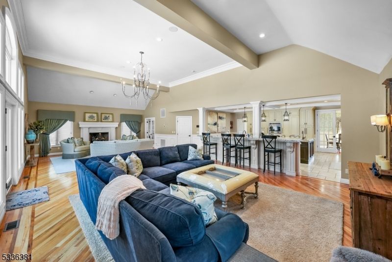 Chandelier, Fireplace, Interior, Living room, Recessed Lighting, Wood Texture Flooring