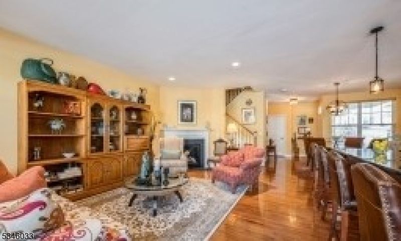 Chandelier, Dining room, Fireplace, Interior, Living room, Pendant Lights, Recessed Lighting, Wood Texture Flooring