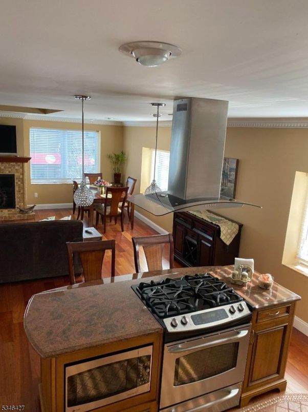 Dining room, Fireplace, Interior, Kitchen, Living room, Pendant Lights, Wood Texture Flooring