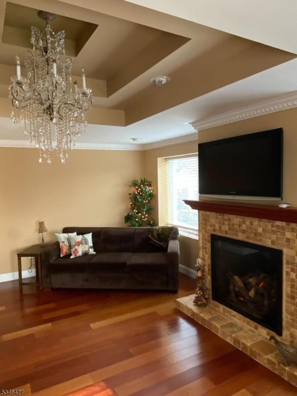 Chandelier, Fireplace, Interior, Living room, Stone Walls, Wood Texture Flooring