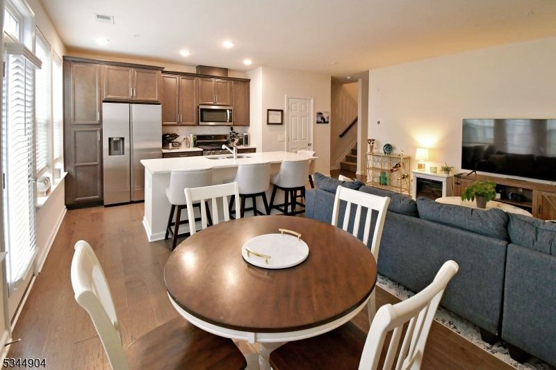 Dining room, Interior, Kitchen, Living room, Recessed Lighting, Stainless Steel Appliances, Wood Texture Flooring