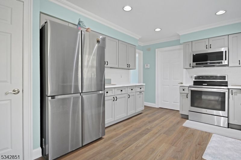 Interior, Kitchen, Recessed Lighting, Stainless Steel Appliances, Wood Texture Flooring