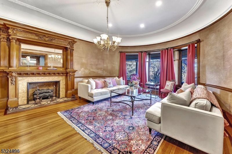 Chandelier, Fireplace, Interior, Living room, Recessed Lighting, Wood Texture Flooring