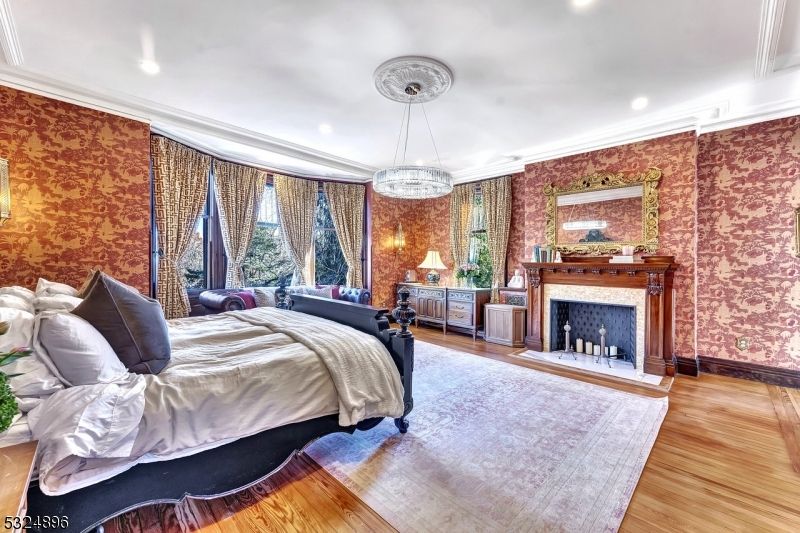 Bedroom, Fireplace, Interior, Recessed Lighting, Wood Texture Flooring