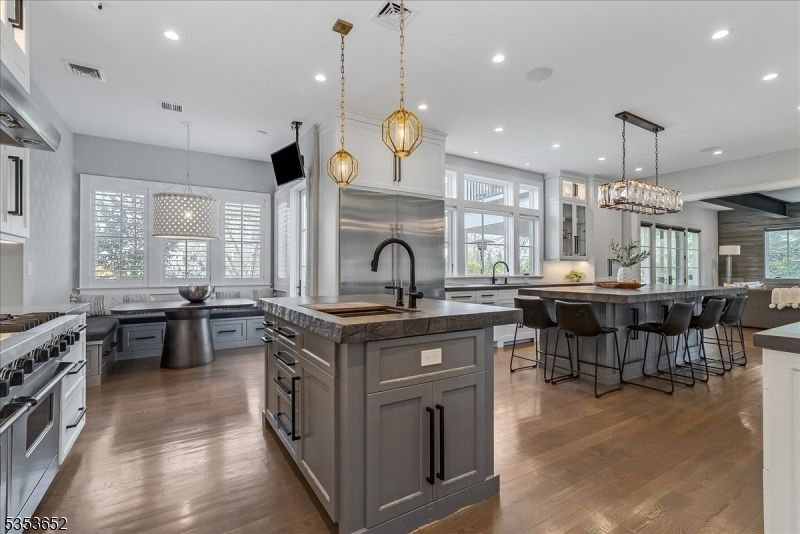 Chandelier, Dining room, Interior, Kitchen, Pendant Lights, Recessed Lighting, Stainless Steel Appliances, Wood Texture Flooring