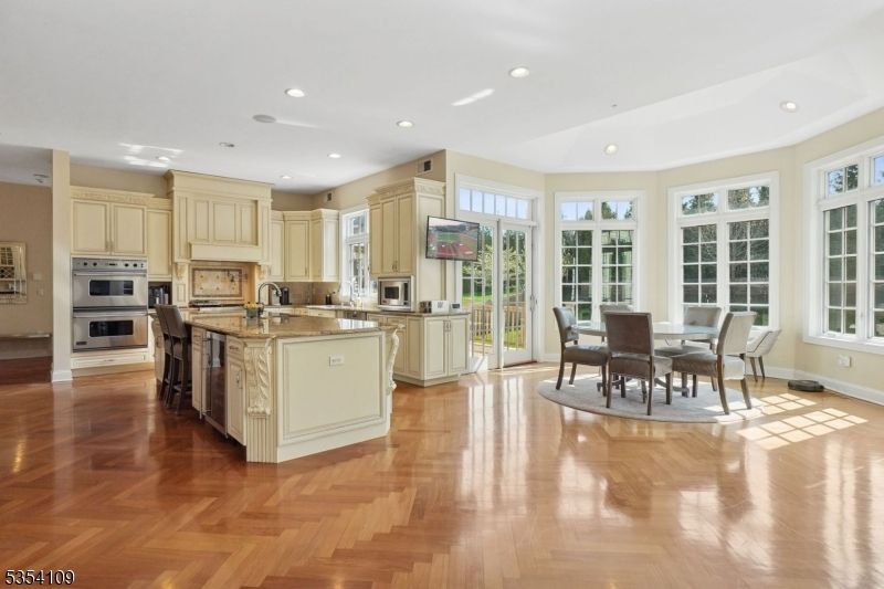 Dining room, Interior, Kitchen, Recessed Lighting, Stainless Steel Appliances, Wood Texture Flooring