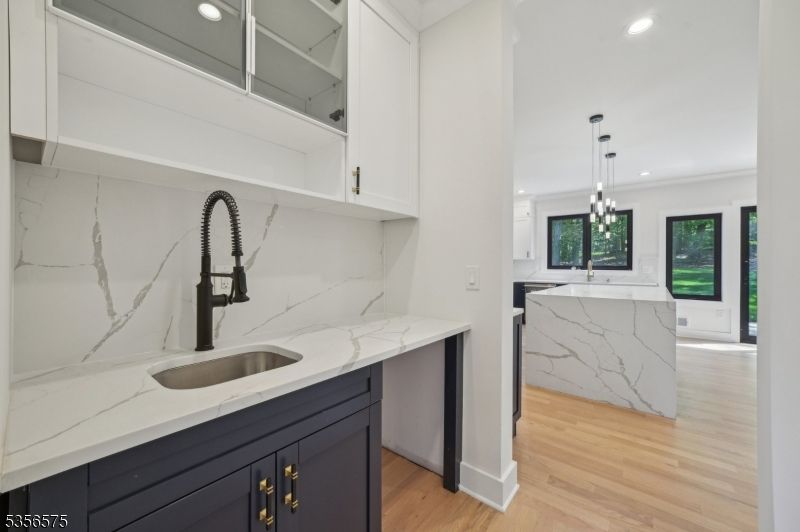 Interior, Kitchen, Marble Walls, Pendant Lights, Recessed Lighting, Wood Texture Flooring