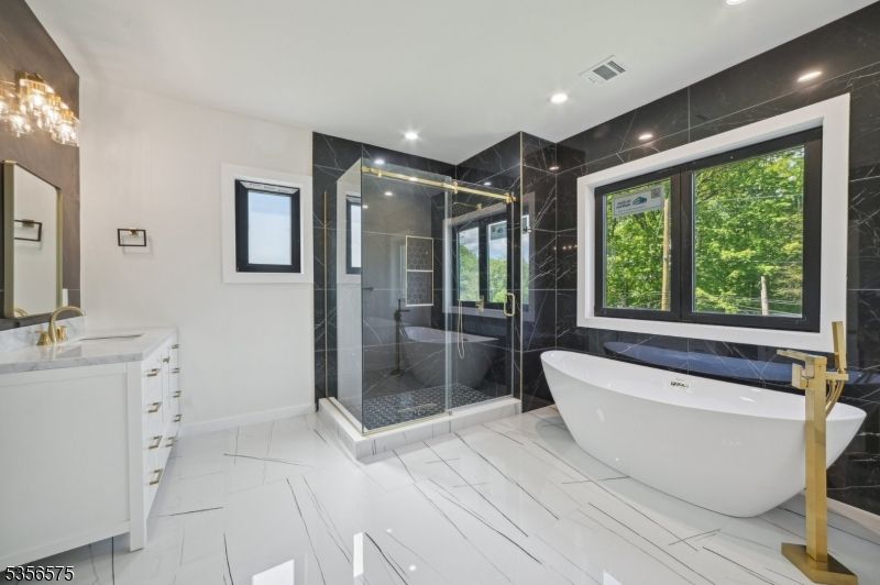 Bathroom, Free Standing Baths, Glass Shower, Interior, Marble, Marble Walls, Recessed Lighting