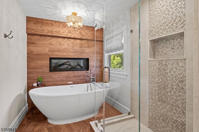 Bathroom, Fireplace, Free Standing Baths, Glass Shower, Interior, Wood Texture Flooring, Wooden Walls