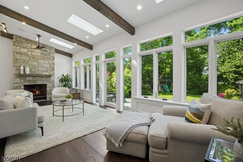 Bedroom, Fireplace, Interior, Living room, Recessed Lighting, Stone Walls, Wooden Beams, Wood Texture Flooring