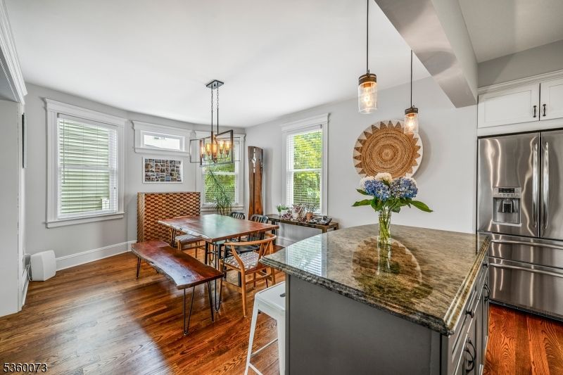 Chandelier, Dining room, Interior, Kitchen, Pendant Lights, Stainless Steel Appliances, Wood Texture Flooring