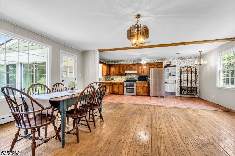 Chandelier, Dining room, Interior, Kitchen, Stainless Steel Appliances, Wood Texture Flooring