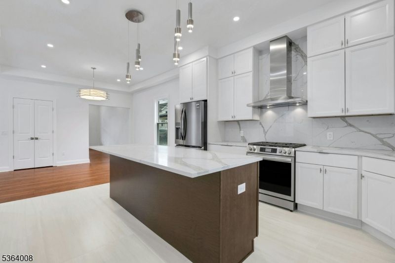 Interior, Kitchen, Marble Walls, Pendant Lights, Recessed Lighting, Stainless Steel Appliances, Wood Texture Flooring