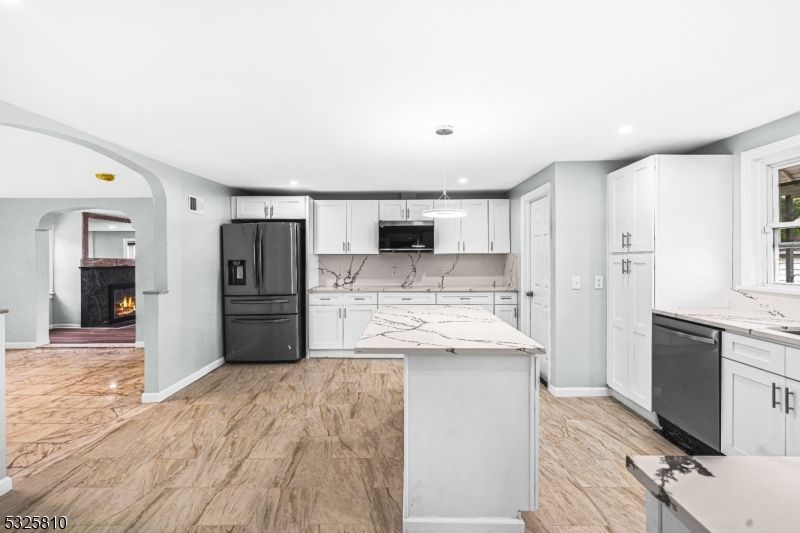 Fireplace, Interior, Kitchen, Marble Walls, Pendant Lights, Recessed Lighting, Stainless Steel Appliances, Wood Texture Flooring