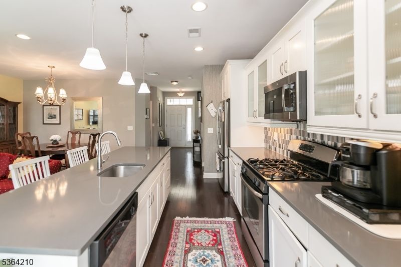 Chandelier, Dining room, Interior, Kitchen, Pendant Lights, Recessed Lighting, Stainless Steel Appliances, Wood Texture Flooring
