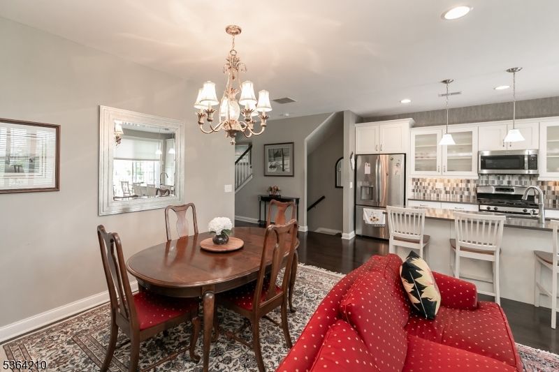 Chandelier, Dining room, Interior, Kitchen, Pendant Lights, Recessed Lighting, Stainless Steel Appliances, Wood Texture Flooring