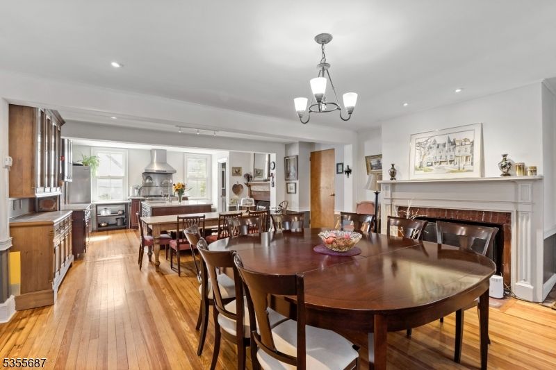 Chandelier, Dining room, Fireplace, Interior, Kitchen, Pendant Lights, Recessed Lighting, Wood Texture Flooring