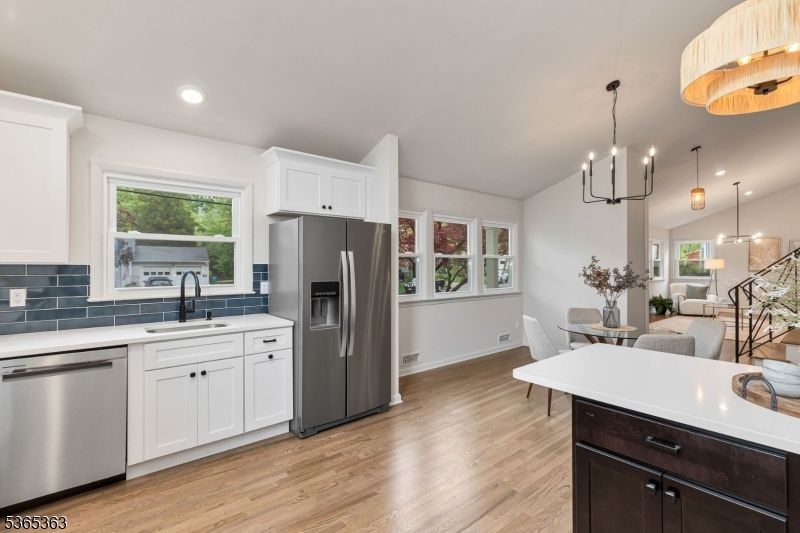 Dining room, Interior, Kitchen, Pendant Lights, Recessed Lighting, Stainless Steel Appliances, Wood Texture Flooring