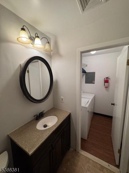 Bathroom, Dual Sink Vanities, Interior, Washer, Wood Texture Flooring