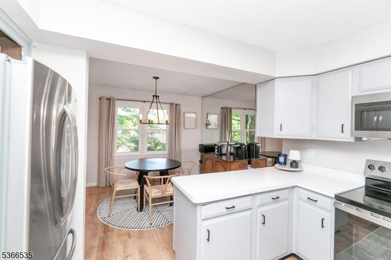 Dining room, Interior, Kitchen, Pendant Lights, Stainless Steel Appliances, Wood Texture Flooring