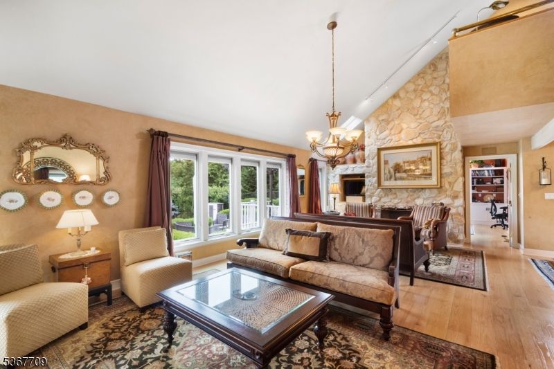 Chandelier, Fireplace, Interior, Living room, Stone Walls, Wood Texture Flooring