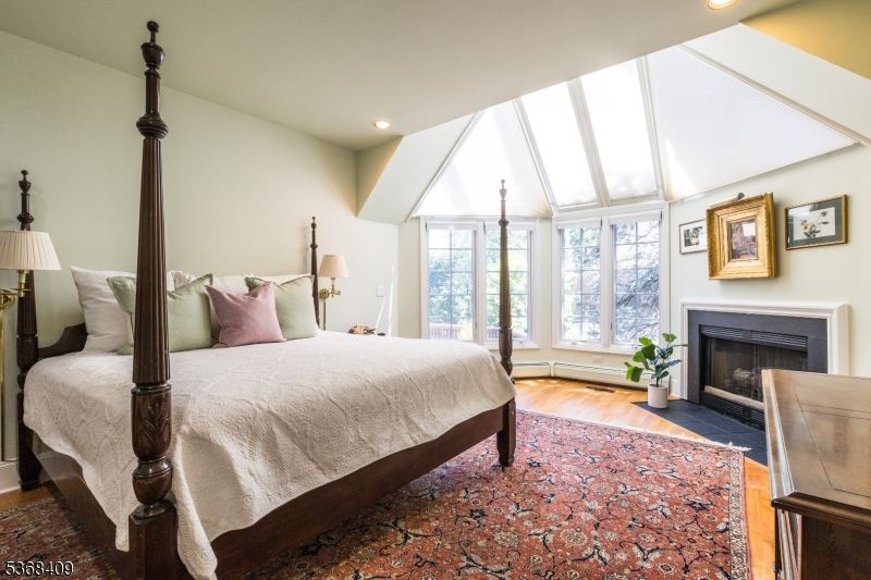 Bedroom, Fireplace, Interior, Recessed Lighting, Wood Texture Flooring