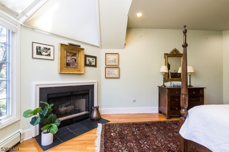 Bedroom, Fireplace, Interior, Recessed Lighting, Wood Texture Flooring