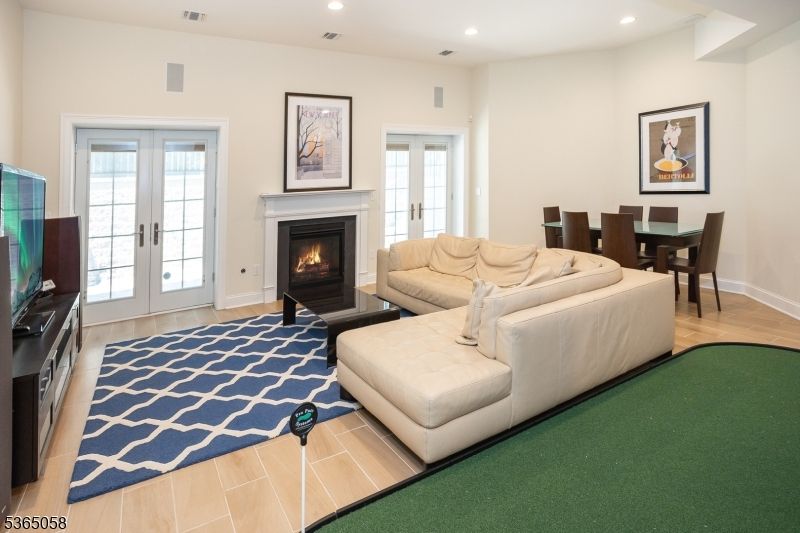 Dining room, Fireplace, Interior, Living room, Recessed Lighting, Wood Texture Flooring