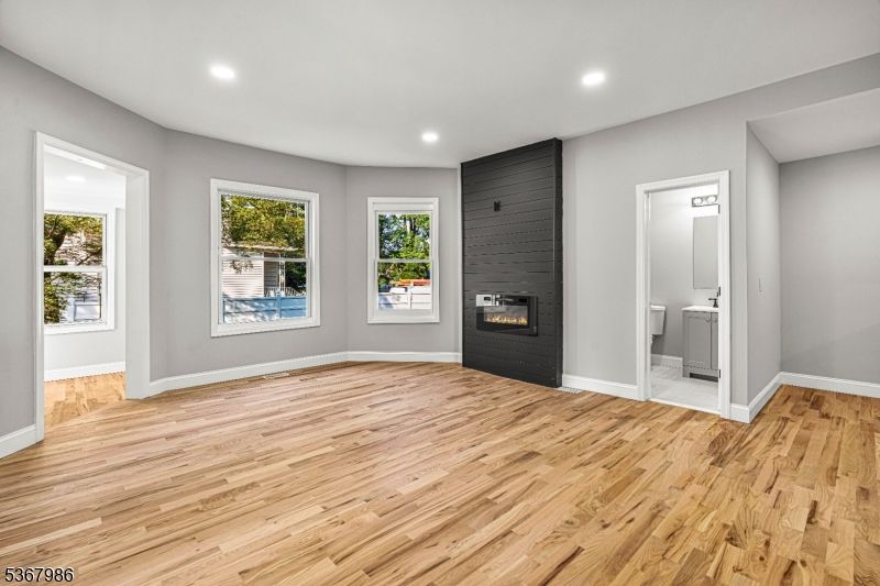 Bathroom, Empty room, Fireplace, Interior, Recessed Lighting, Wood Texture Flooring