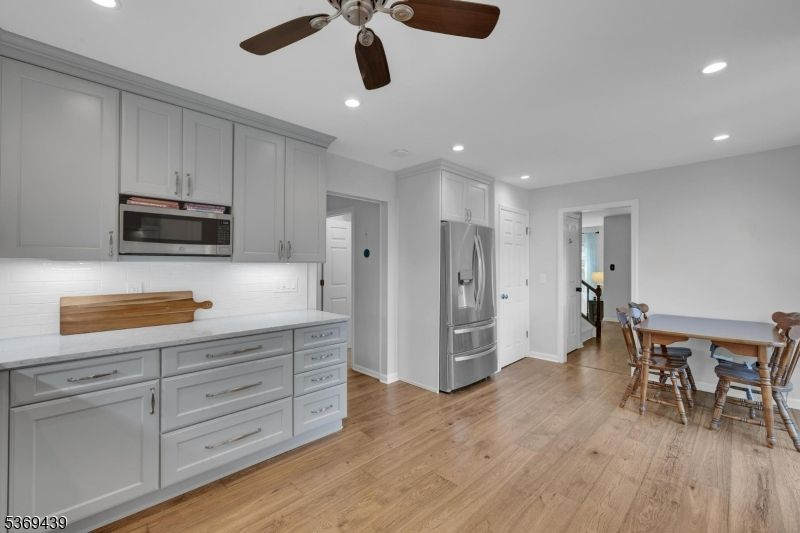 Dining room, Interior, Kitchen, Recessed Lighting, Stainless Steel Appliances, Wood Texture Flooring